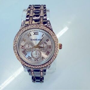 Bebe watch Silver and gold rhinestone bezel and band new battery